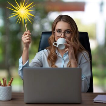 woman sat at a desik in front of a laptop, drinking coffee and waving a magic wand