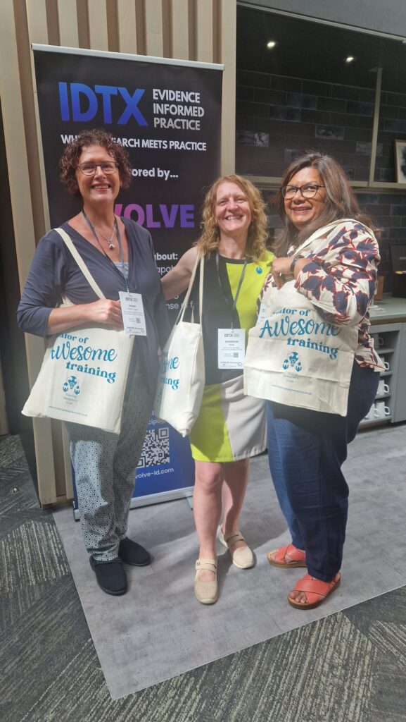 Image of me at the IDTX conference with 2 VIP members. We are smiling and holding Training Designer's Clubs bags.