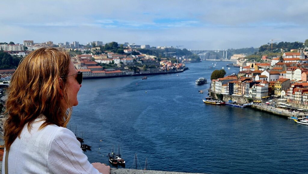 Sheridan looking over the river in Porto